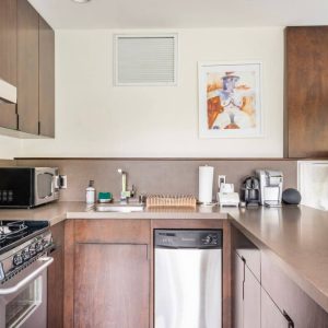 A kitchen with wooden cabinets and white appliances.