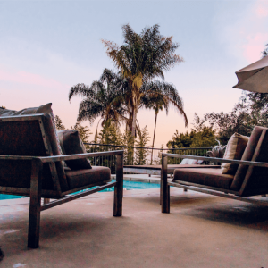 A view of a pool and some chairs.