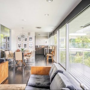 A living room with a couch and chairs in it