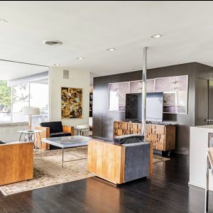 A living room with wooden floors and furniture.