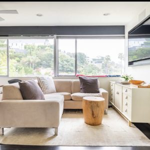 A living room with couches and tables in it