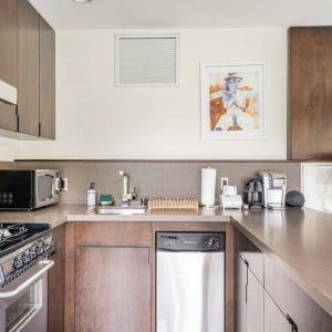 A kitchen with wooden cabinets and white appliances.